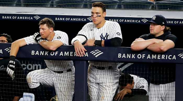 Jun 4, 2021; Bronx, New York, USA; New York Yankees first baseman DJ LeMahieu (26) and right fielder Aaron Judge (99) and injured first baseman Luke Voit (59) look on from the dugout during the ninth inning against the Boston Red Sox at Yankee Stadium.